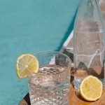 Drink tap water in Lefkada - glass with lemon by a pool