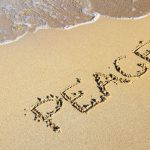Anxious solo traveler relaxing by the beach in Lefkada