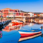 Colorful fishing boats docked at the marina in Lefkada Town, Greece