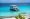 Tourist boat anchored near a turquoise beach in Lefkada, Greece