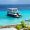 Tourist boat anchored near a turquoise beach in Lefkada, Greece