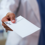 Tourist getting a prescription in Lefkada from a doctor